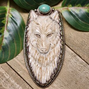 Carved Bone Wolf Pendant with a Turquoise Cab Accent